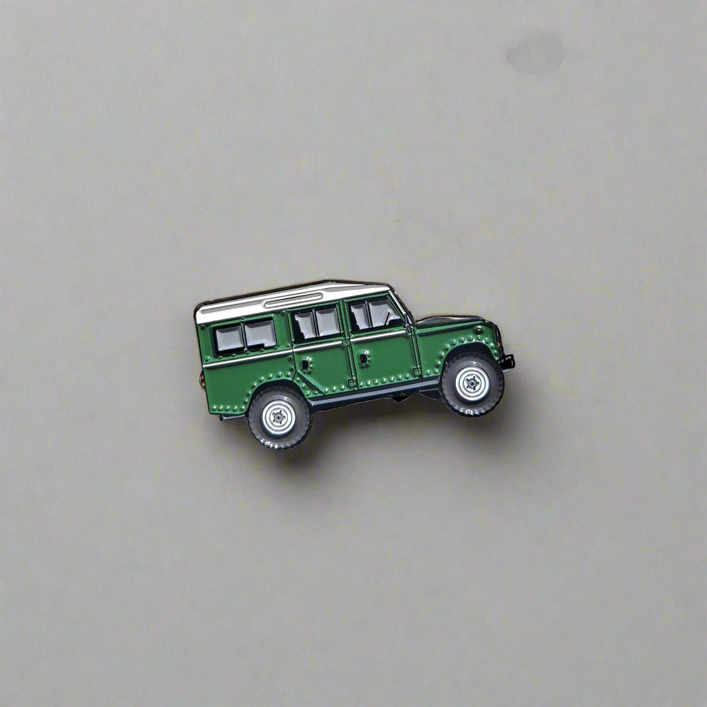 Land_Rover_Defender_green enamel pin on white background
