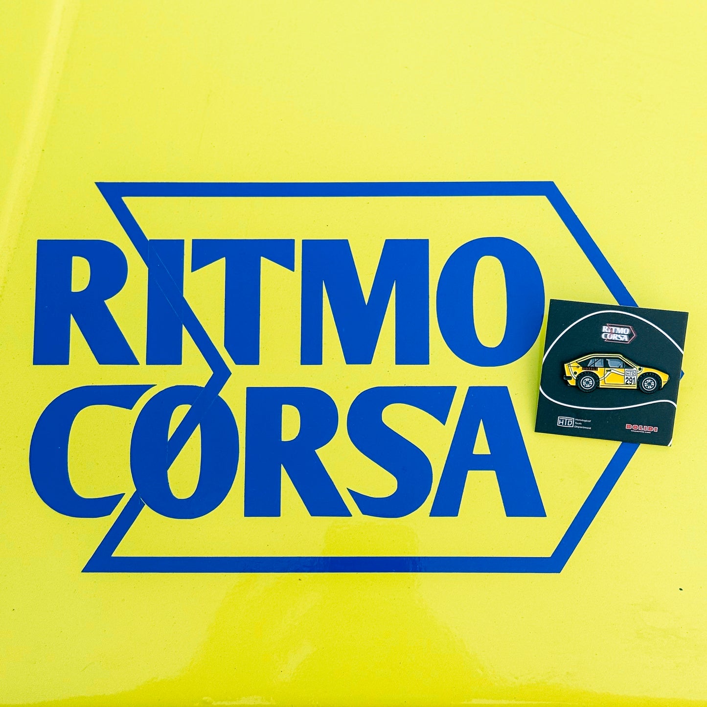 Ritmo Corsa logo and car pin