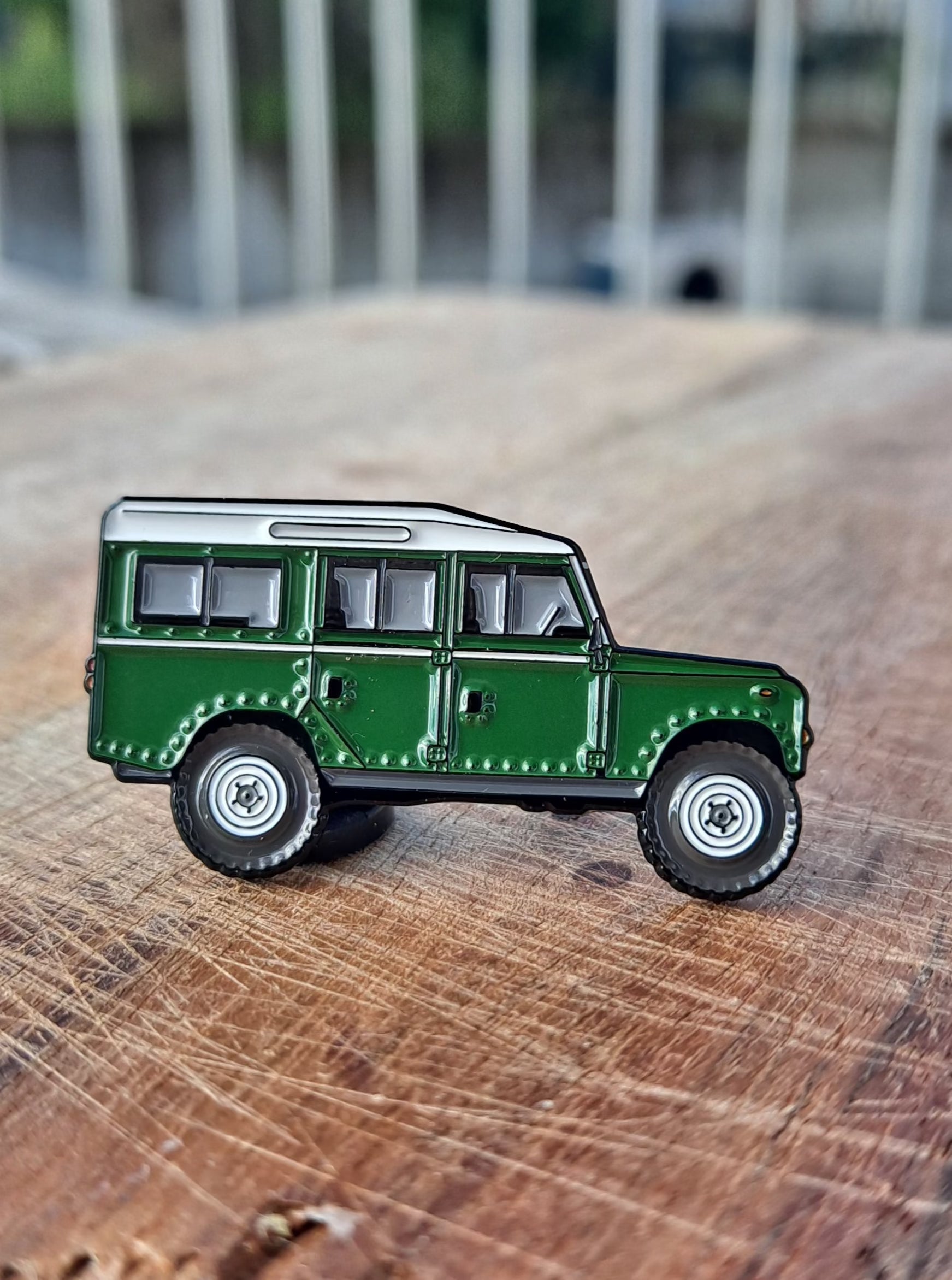 Defender Series III Sand Enamel Pin featuring the iconic Land Rover Defender design in green color, with high-quality enamel finish and double black rubber pin clutches on the back