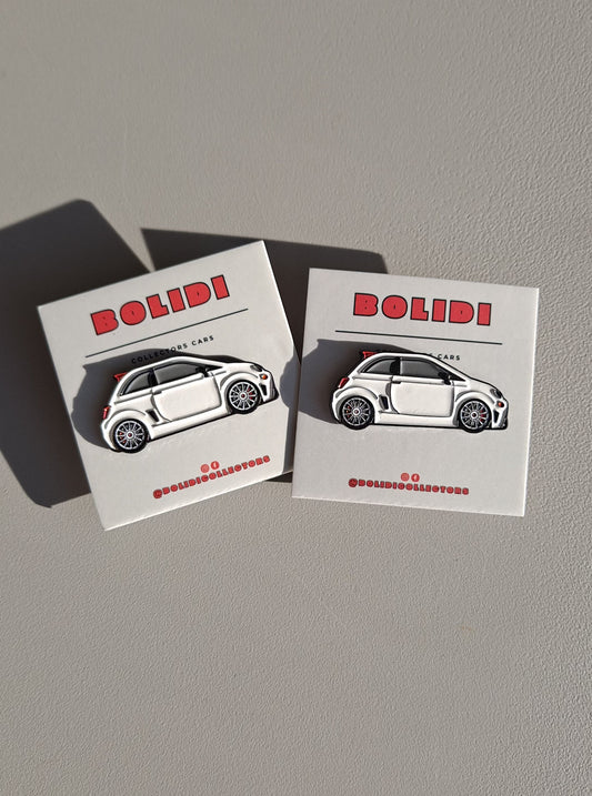 Fiat 500 Abarth white enamel pins on white surface